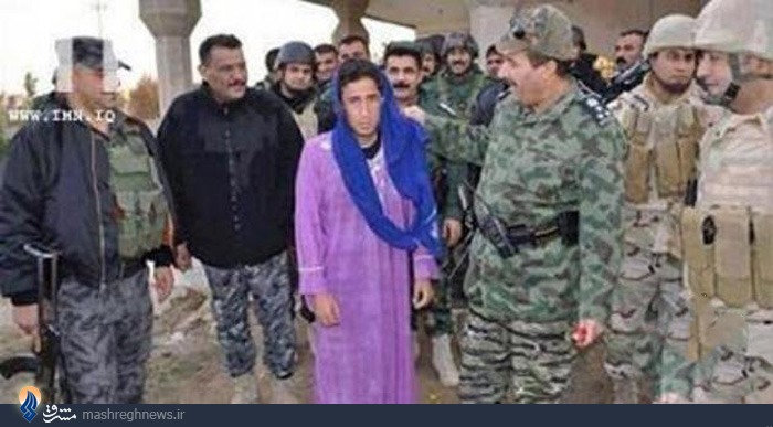 عکس/دستگیری یک داعشی با لباس زنانه