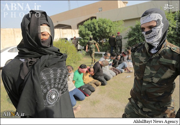 عکس/ بازداشت عضو داعش با لباس زنانه